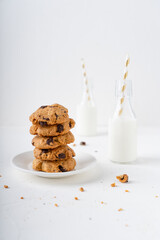 American cookies with chocolate on a white background. Cookies with milk for breakfast. 