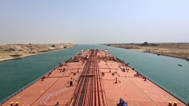 Time lapse oil tanker max bow transit crossing Suez canal sunny day