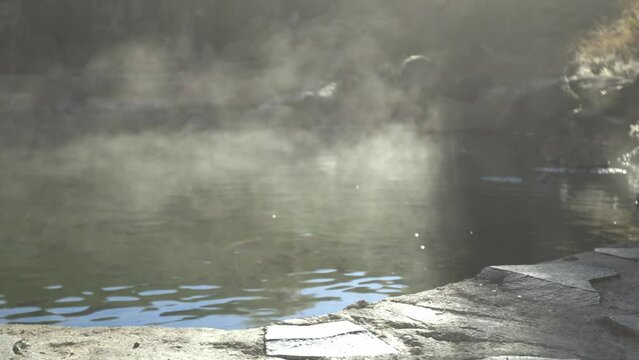 Steamy smoke from Idaho hot springs with fishes moving around 