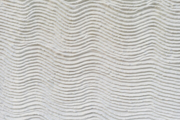Close-up of horizontal waves in the mortar of a house wall