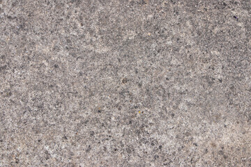 Gray grunge. Abstract stone background. The texture of the stone wall. Close-up. Light gray rock backdrop.
