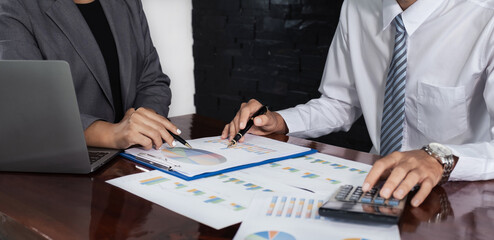 businessmen and businesswomen team meeting to plan strategies to increase business income. Have a brainstorming graph analysis and discussing for the new target success