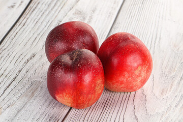 Ripe sweet juicy nectarines heap