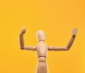 A wooden man with his arms in different directions. Creative design.