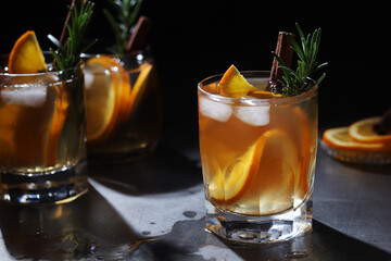 Orange rosemary bourbon cocktail in low key	