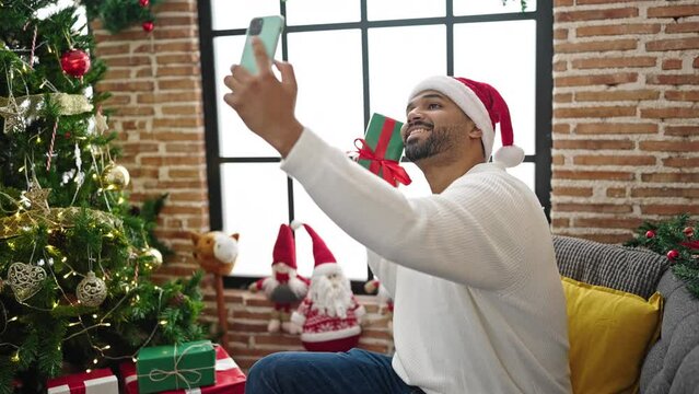 African american man taking a selfie picture celebrating christmas at home