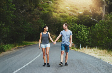 Road, love or happy couple holding hands or walking on date with smile, care for romance or adventure. Peace, freedom or man with woman on holiday vacation together for bond, support or wellness