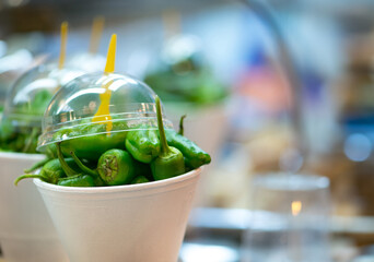 Green fresh peppers at the market