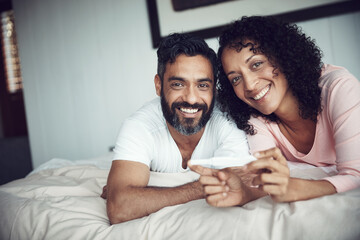 Couple, happy and portrait with pregnancy test, bedroom and positive with smiling, results and excited. Man, woman and baby with stick, love and maternity for future family, surprise and pregnant - obrazy, fototapety, plakaty