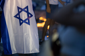 Lisbon, Portugal October 10, 2023. The flag of Israel in close-up on the background of a rally in...