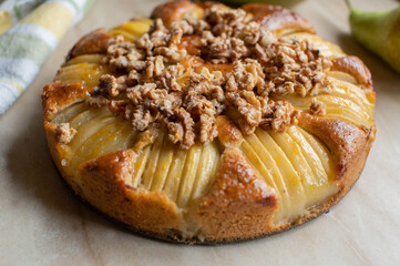 Homemade Pear cake with caramelized walnuts. Closeup