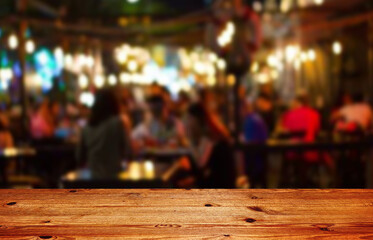 Wooden table top on blur restaurant background.For montage product display or design key visual...