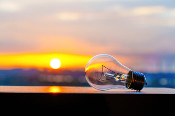 Incandescent Light Bulb Close-up at Sunset