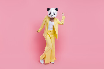 Full body photo of elegant carefree 3d panda mask lady dance partying empty space isolated on pink...