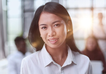 Young beautiful Asian business woman consultant , portrait of an employee looking at the camera