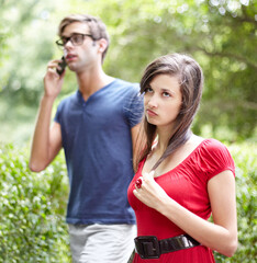 Couple fight, phone call and woman frustrated by cheating man, liar or bored with relationship in a...