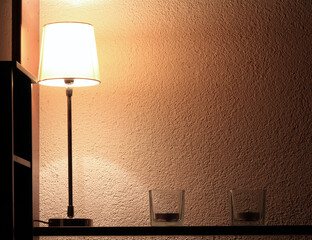 Lamp And Candles On A Book Shelf