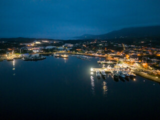 Naklejka na ściany i meble Aerial night view of Killybegs, the most important fishing harbour town in Ireland, County Donegal