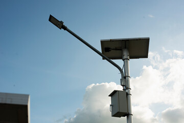 Small self-contained solar panel powered outdoor lighting pole or new technologies and energy...