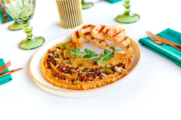 Hummus. Large plate of homemade hummus garnished with croutons, flat lay.