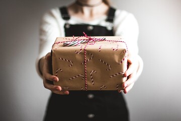 woman with a gift box, woman holding a gift box, woman holding a birthday gift box