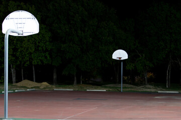 A street basketball court at night