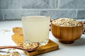 A glass of oat jelly, home medicine, a healthy fermented drink made from oats. - obrazy, fototapety, plakaty