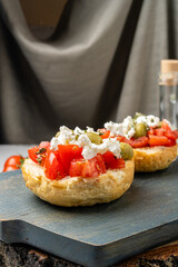 Delicious Greek snack made from bread, tomatoes, cheese, cottage cheese and aromatic olive oil.