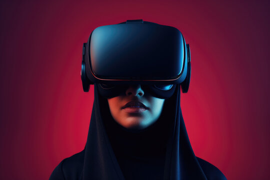 Asian girl in black hijab and black virtual reality goggles on red gradient background.