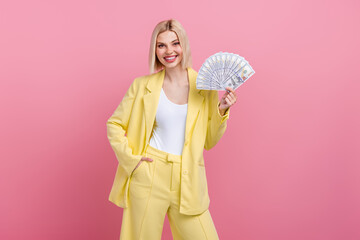 Photo of cool confident woman dressed blazer suit rising money fan isolated pink color background