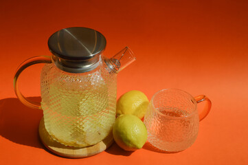 water with lemon. a healthy refreshing summer drink, lemonade. background for the design.