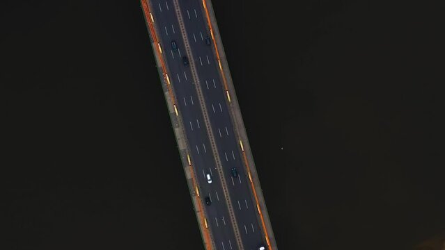 Aerial view of a new bridge over the Vistula river, on which many cars move. Warsaw, Poland. Siekierki (Siekierkowski) Bridge