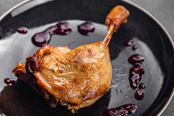 fresh duck leg confit berry sauce poultry meat eating cooking appetizer meal food snack on the table copy space food background rustic top view