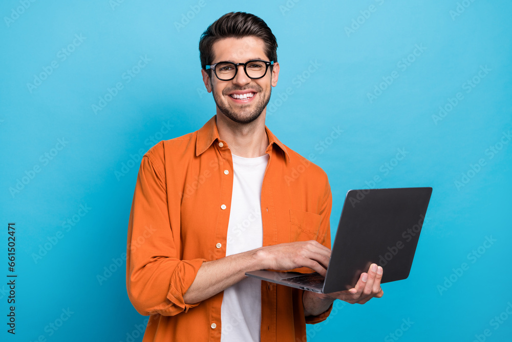 Poster photo of cheerful corporate agent man toothy smile hold use wireless netbook networking isolated on 
