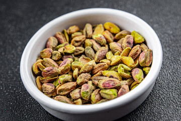 fresh pistachios peeled without shell nut eating cooking appetizer meal food snack on the table copy space food background rustic top view 