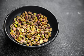 fresh pistachios peeled without shell nut eating cooking appetizer meal food snack on the table copy space food background rustic top view 