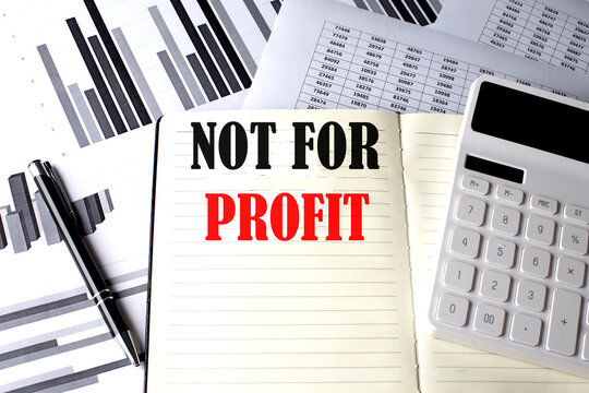 NOT FOR PROFIT text written on a notebook on chart and diagram