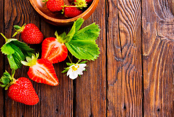 Fresh ripe organic strawberry on wooden table