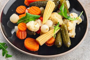 vegetable pickled salad cucumber, gherkin, carrot, onion, cauliflower, pepper appetizer meal food snack on the table copy space food background rustic top view