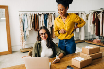 Women in dropshipping: Female business owners using a laptop in their store