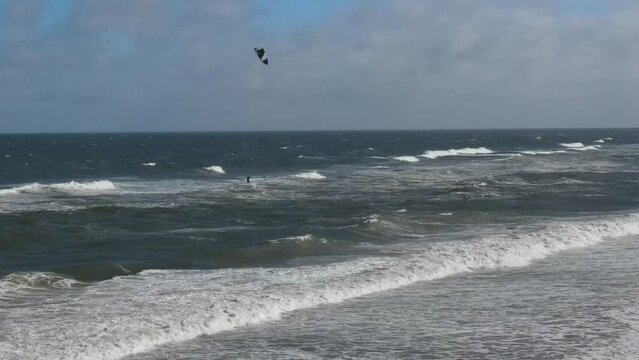 High Angle Footage of Kite surfing over Beach and Ocean of Northumberland England UK. The Footage Was Captured with Drone's Camera on Jan 24th, 2021