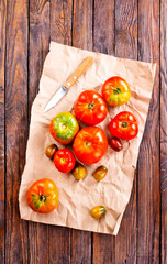 fresh tomato on paper on a table