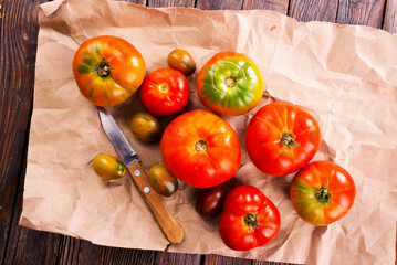 fresh tomato on paper on a table