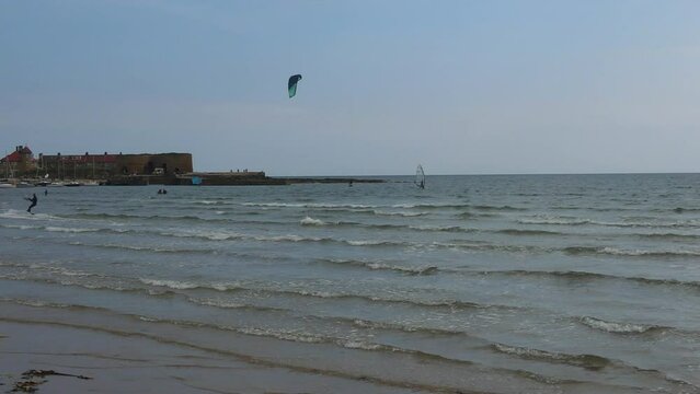 High Angle Footage of Kite surfing over Beach and Ocean of Northumberland England UK. The Footage Was Captured with Drone's Camera on Jan 24th, 2021