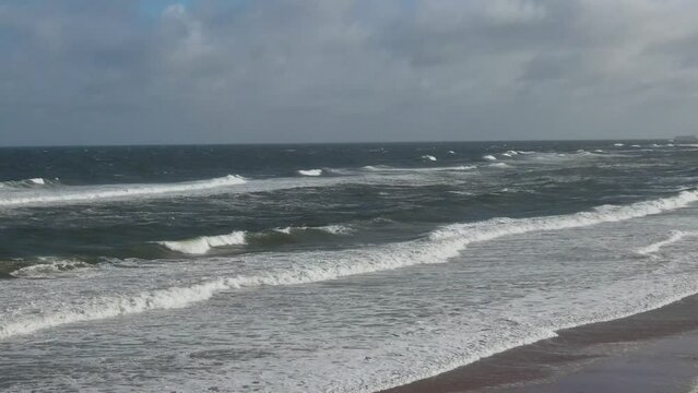 High Angle Footage of Kite surfing over Beach and Ocean of Northumberland England UK. The Footage Was Captured with Drone's Camera on Jan 24th, 2021
