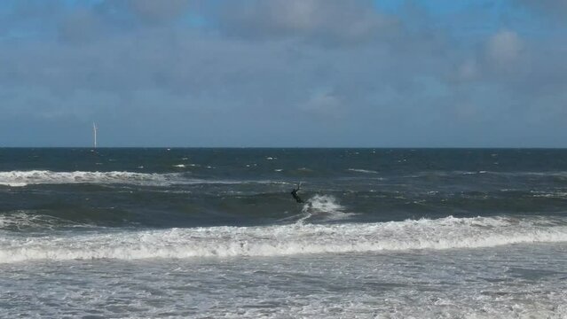 High Angle Footage of Kite surfing over Beach and Ocean of Northumberland England UK. The Footage Was Captured with Drone's Camera on Jan 24th, 2021