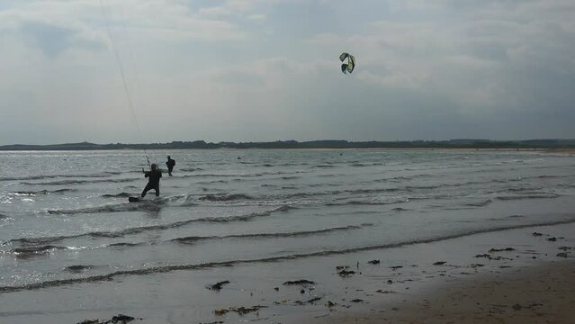 High Angle Footage of Kite surfing over Beach and Ocean of Northumberland England UK. The Footage Was Captured with Drone's Camera on Jan 24th, 2021