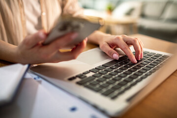 Young woman working from her laptop at home