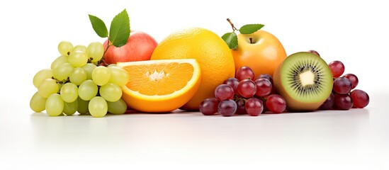 Assorted fruits kiwi orange apple grapes grapefruit With copyspace for text
