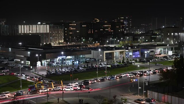 Heavy traffic on the streets of the night city. Cars in motion and standing in traffic jams.
